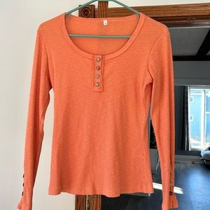Long sleeved orange shirt with buttons - size small